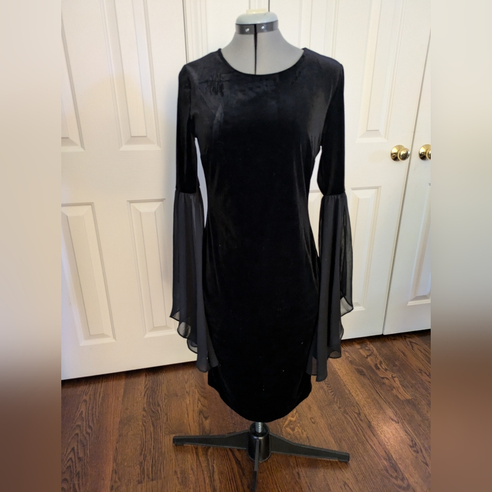Black dress with dramatic sheer bell sleeves